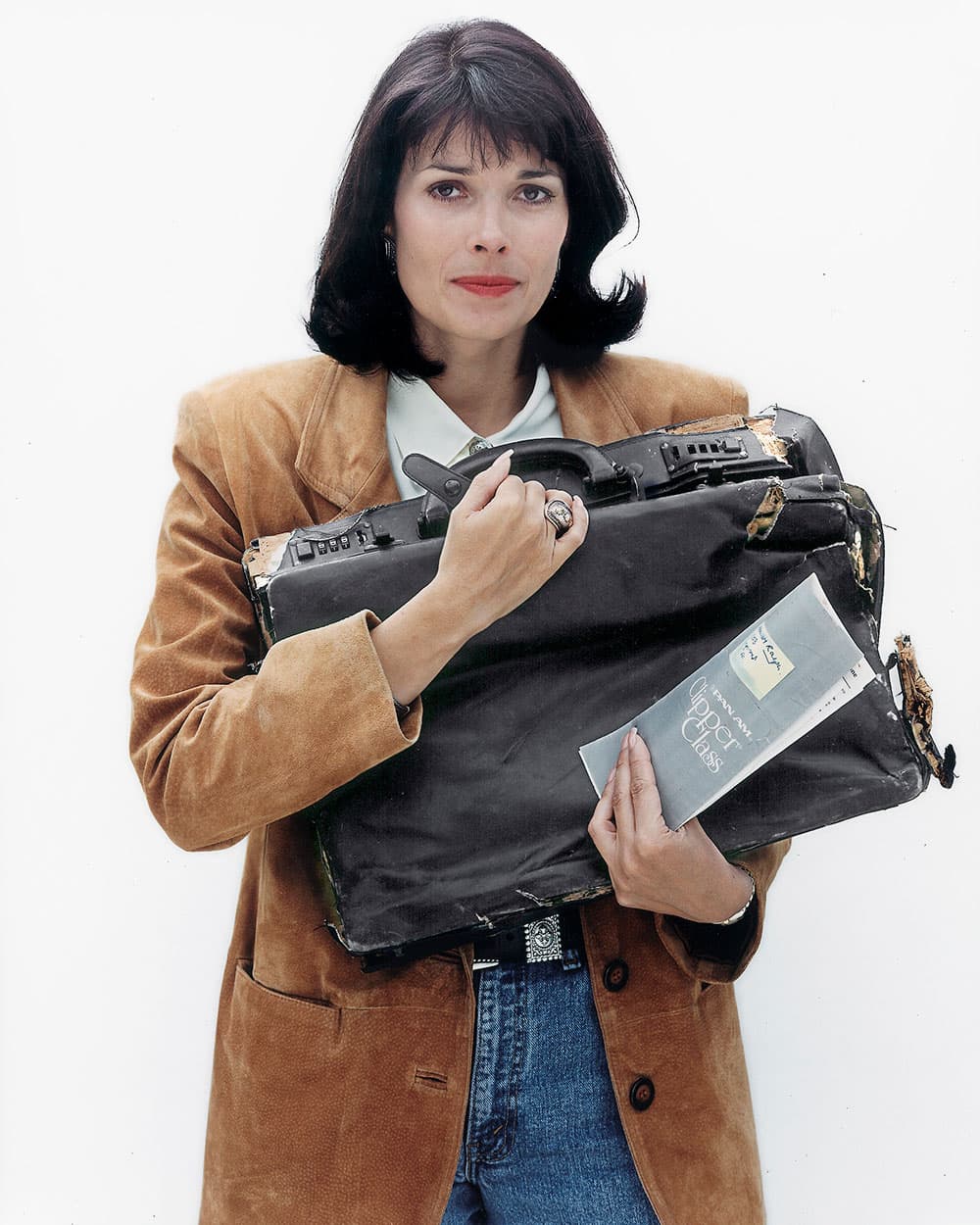 Victoria Cummock Holding Attache Case of Murdered Husband John Cummock